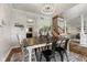 Dining room featuring an elegant chandelier, stylish decor, and hardwood flooring at 10988 Eaton Ct, Fishers, IN 46038