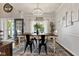 Charming dining room featuring a stylish chandelier, hardwood flooring, and plenty of natural light at 10988 Eaton Ct, Fishers, IN 46038