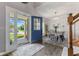 Open entryway leading to a dining room with stylish decor and hardwood flooring at 10988 Eaton Ct, Fishers, IN 46038