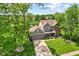 Charming two-story home featuring a well-manicured lawn, mature trees, and a welcoming front porch at 10988 Eaton Ct, Fishers, IN 46038