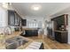 Kitchen featuring dark cabinets, granite countertops, and stainless steel appliances at 10988 Eaton Ct, Fishers, IN 46038