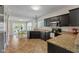 Kitchen featuring dark cabinets, granite countertops, and stainless steel appliances at 10988 Eaton Ct, Fishers, IN 46038