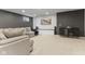 Spacious living room featuring neutral walls, plush carpet, and an entertainment area at 10988 Eaton Ct, Fishers, IN 46038