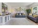 Cozy living room with neutral tones, comfortable seating, stylish decor, and ample natural light at 10988 Eaton Ct, Fishers, IN 46038