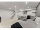 Basement living room featuring neutral walls, carpeted floors, and a large sectional sofa at 10988 Eaton Ct, Fishers, IN 46038