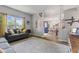 Inviting living room with neutral tones, comfortable seating, and an open layout at 10988 Eaton Ct, Fishers, IN 46038