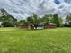 A lovely view of the backyard featuring an enclosed patio and fenced yard, offering a peaceful outdoor space at 1103 Canal St, Anderson, IN 46012