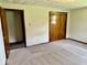The bedroom features a neutral carpet and a closet at 1103 Canal St, Anderson, IN 46012