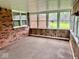 This porch features brick and wood paneled walls at 1103 Canal St, Anderson, IN 46012