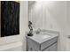 This is a bathroom with a light grey vanity, a white sink, and a mirror. The bathroom has a modern design at 11912 Vale St, Indianapolis, IN 46235