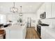 Spacious kitchen featuring white cabinets, stainless appliances, and a large center island at 1239 Thornwood Dr, Greenwood, IN 46143
