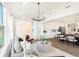 Bright and airy living space with modern furnishings, stylish lighting, and seamless kitchen access at 1239 Thornwood Dr, Greenwood, IN 46143