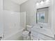 Well-lit bathroom featuring a vanity with sink, toilet, and shower/tub combination with white finishes at 1276 Sanderling Dr, Greenwood, IN 46143