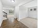 Bright foyer features hardwood floors, entry to living room and a view of carpeted office space at 1276 Sanderling Dr, Greenwood, IN 46143