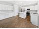 Modern kitchen with stainless steel appliances, white cabinetry, and center island at 1276 Sanderling Dr, Greenwood, IN 46143