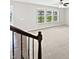 Bright living room with three large windows offering a view of the water outside at 1276 Sanderling Dr, Greenwood, IN 46143