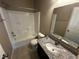 Standard bathroom featuring shower-tub combo, single sink vanity and tile flooring at 14462 Brook Meadow Dr, McCordsville, IN 46055