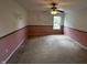Bright bedroom featuring ceiling fan, neutral carpet, and a window that lets in plenty of natural light at 14462 Brook Meadow Dr, McCordsville, IN 46055