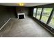 Spacious living room featuring a fireplace and lots of natural light from the many windows at 14462 Brook Meadow Dr, McCordsville, IN 46055