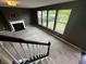 Spacious living room featuring a fireplace and lots of natural light from the many windows at 14462 Brook Meadow Dr, McCordsville, IN 46055