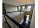 Open loft space overlooking the foyer with lots of natural light and a chandelier at 14462 Brook Meadow Dr, McCordsville, IN 46055