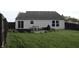 Enjoy the backyard with a patio, outdoor seating, and lush green lawn at 1461 Ripplewood Dr, Danville, IN 46122