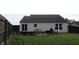 Backyard with a patio, outdoor seating, privacy fence, and well maintained lawn at 1461 Ripplewood Dr, Danville, IN 46122
