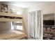 Charming bedroom with a bunk bed, closet, and shelving unit, providing ample storage and a cozy feel at 1461 Ripplewood Dr, Danville, IN 46122