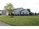 Residential home featuring a well-manicured front lawn, small shrubbery, and charming curb appeal at 1461 Ripplewood Dr, Danville, IN 46122