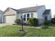 Charming home with brick accents, inviting entry, and tidy landscaping at 1461 Ripplewood Dr, Danville, IN 46122