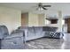 Living room with a gray couch, light-colored walls and view into the kitchen at 1461 Ripplewood Dr, Danville, IN 46122