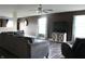 Open-concept living room with large couch, stylish decor, and plenty of natural light at 1461 Ripplewood Dr, Danville, IN 46122