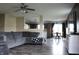 Living room featuring gray couch, open layout, and eat-in kitchen and dining space at 1461 Ripplewood Dr, Danville, IN 46122