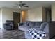 Comfortable living room with neutral walls, plush seating, and a modern ceiling fan at 1461 Ripplewood Dr, Danville, IN 46122