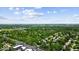 Overhead view of a community surrounded by lush trees and foliage, offering a serene escape at 14814 Beacon Blvd, Carmel, IN 46032