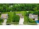 Aerial view of the house and surrounding community featuring mature trees and landscaping at 14814 Beacon Blvd, Carmel, IN 46032