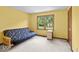Bright bedroom with a futon and a large window with backyard views at 14814 Beacon Blvd, Carmel, IN 46032