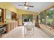 Bright dining room with a ceiling fan, and sliding glass doors leading to the backyard at 14814 Beacon Blvd, Carmel, IN 46032