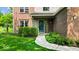 Charming front entrance with a well-kept garden and a welcoming pathway at 14814 Beacon Blvd, Carmel, IN 46032