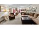 Open-concept living area with a cozy fireplace and views into the spacious kitchen at 14814 Beacon Blvd, Carmel, IN 46032