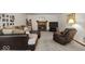 Comfortable living room with a fireplace, plush seating, and tasteful decor for relaxing evenings at 14814 Beacon Blvd, Carmel, IN 46032