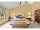 Warm and inviting main bedroom with a large bed, vaulted ceiling, and ample natural light at 14814 Beacon Blvd, Carmel, IN 46032