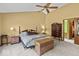 Well-lit main bedroom with a king-sized bed, chest, and ample closet space at 14814 Beacon Blvd, Carmel, IN 46032