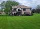 Expansive backyard with lush green grass and a spacious deck, perfect for outdoor entertaining at 1714 Michelle Mnr, Danville, IN 46122