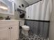 Bathroom with patterned floor, modern vanity and a stylish shower curtain at 1714 Michelle Mnr, Danville, IN 46122