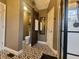 Nicely decorated bathroom with patterned tile, sliding wooden door, and modern fixtures at 1714 Michelle Mnr, Danville, IN 46122