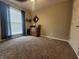 Bedroom with carpet floors, a cabinet, and a window providing natural light at 1714 Michelle Mnr, Danville, IN 46122
