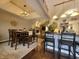 Open-concept dining area with a large wooden table and stylish light fixtures at 1714 Michelle Mnr, Danville, IN 46122
