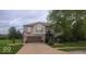 Beautiful two-story home with a well-manicured lawn and inviting front porch at 1714 Michelle Mnr, Danville, IN 46122