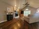 Bright living room with a fireplace, comfortable seating, and hardwood floors at 1714 Michelle Mnr, Danville, IN 46122